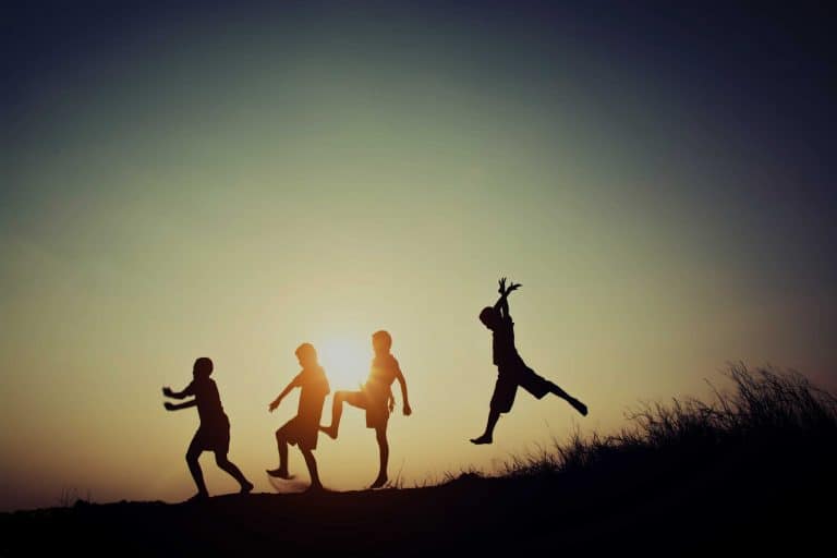 A group of friends runs downhill