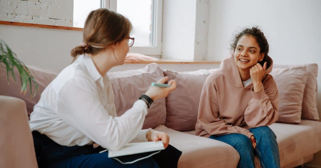Young Woman Talking with Therapist