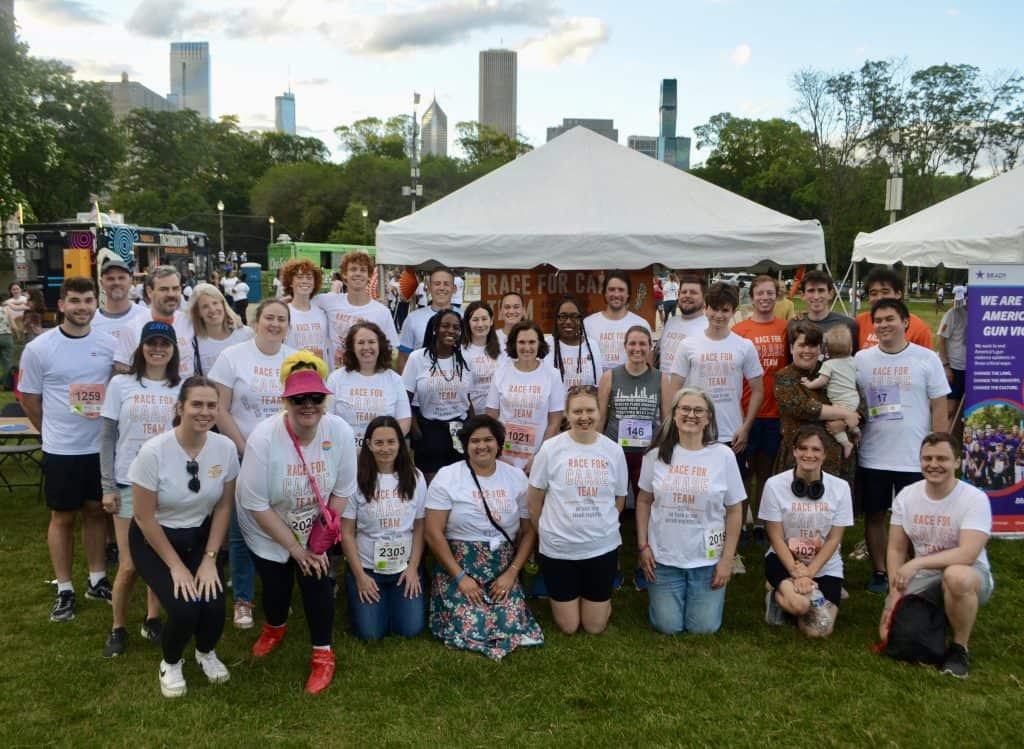 A group photo of CAASE supporters and participants at Race for CAASE 2024.