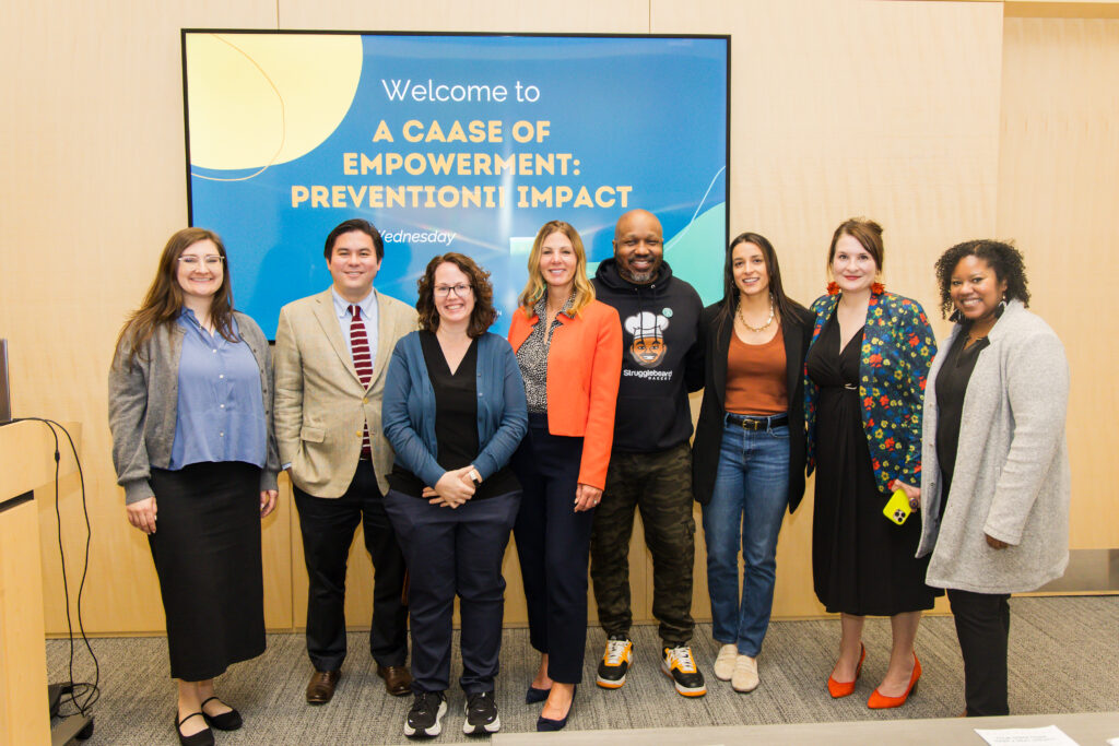 A photo of eigth CAASE board members together at A CAASE of Empowerment 2026.