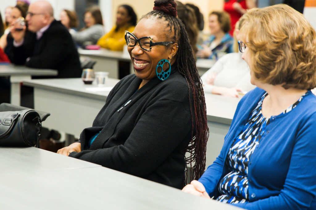 A CAASE staff member is show laughing at A CAASE of Empowerment 2026